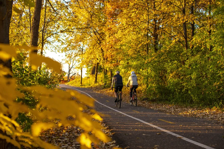 Two bicyclists on the Cedar Lake Trail