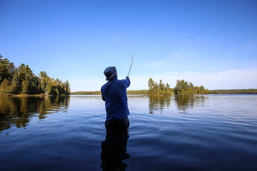 Fly fishing in the clear waters of Superior National Forest
