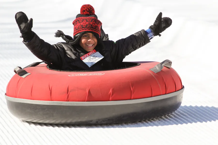 Boy snow tubing at Buck Hill in Burnsville.jpg