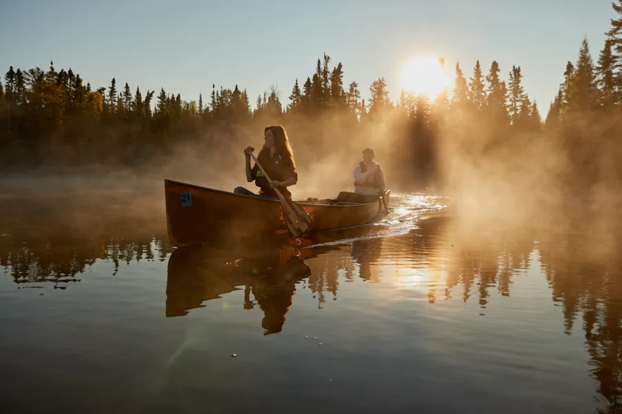 A couple canoeing in the Boundary Waters Canoe Area
