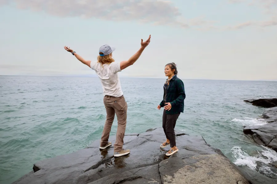 A couple stands on the shores of Lake Superior in Northern Minnesota 