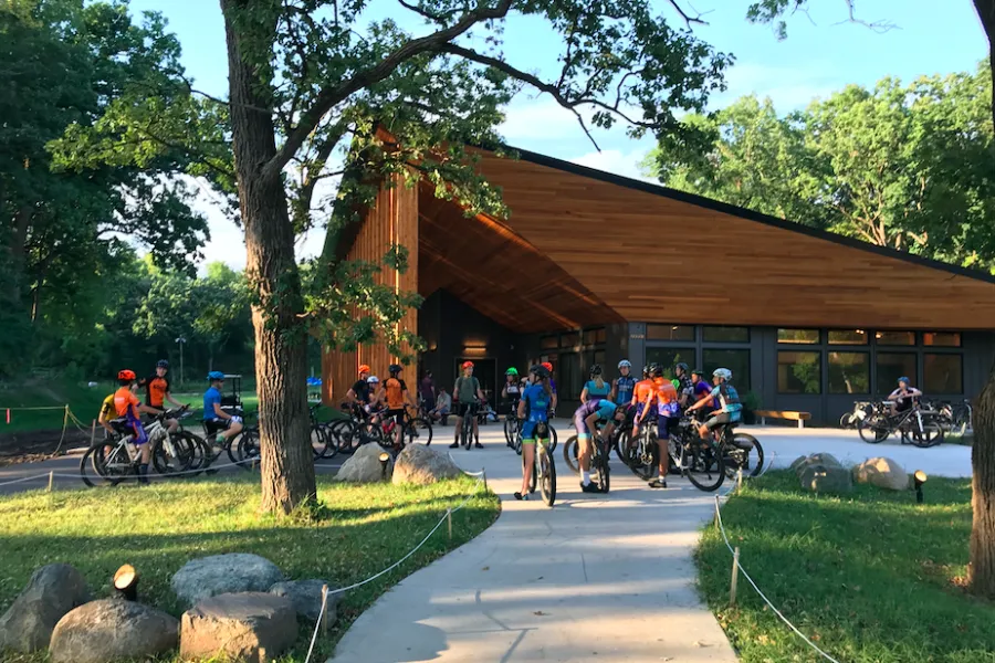 A group of mountain bikers gather at Theodore Wirth Park