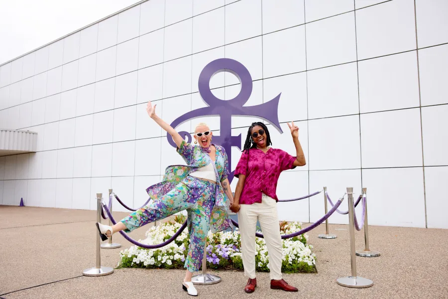 A couple poses outside Paisley Park 