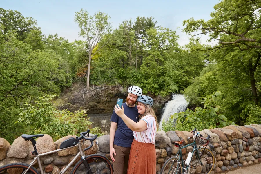 A couple bikers snap a selfie near Minnehaha Falls