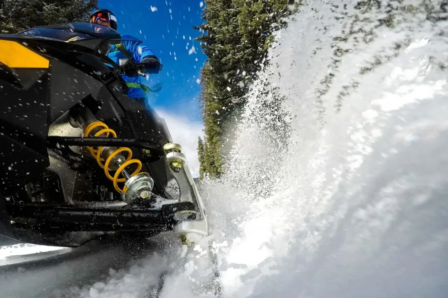 A snowmobiler kicks up snow in the Leech Lake area