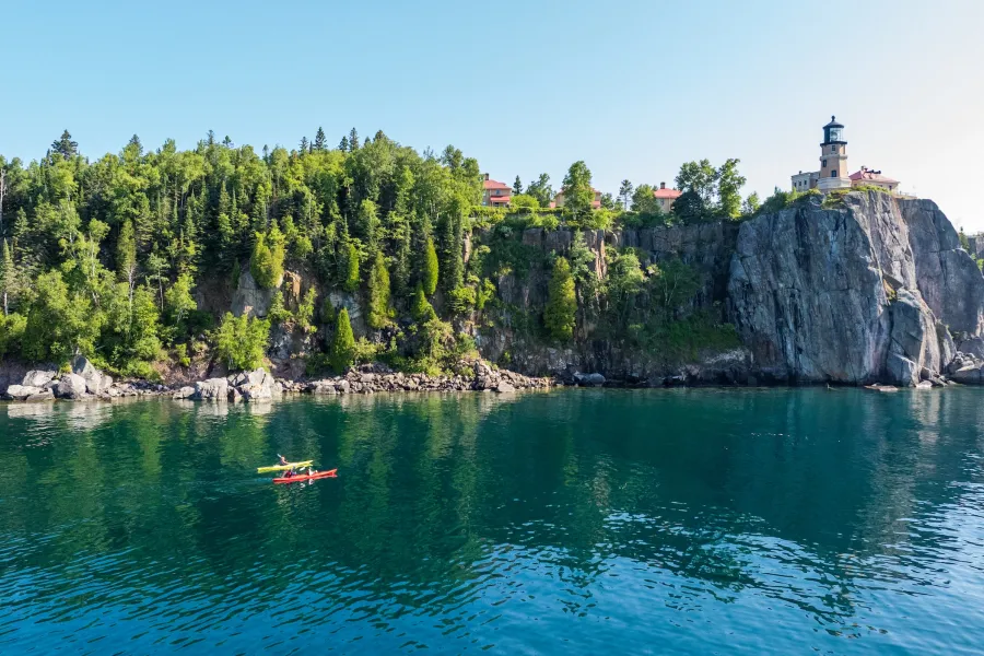 Two people paddle on Lake Superior near Split Rock Lighthouse 