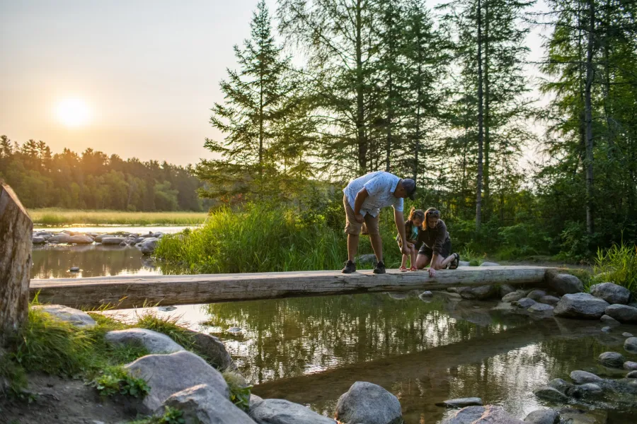 A family visits the Mississippi Headwaters at Itasca State Park 