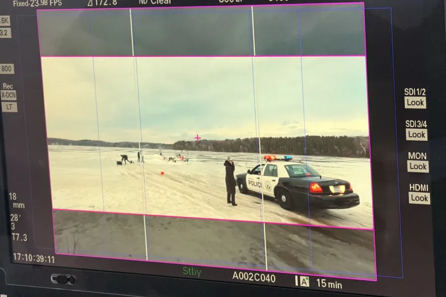 A camerman lines up a shot for Minnesota Film's "On the Case Again" campaign