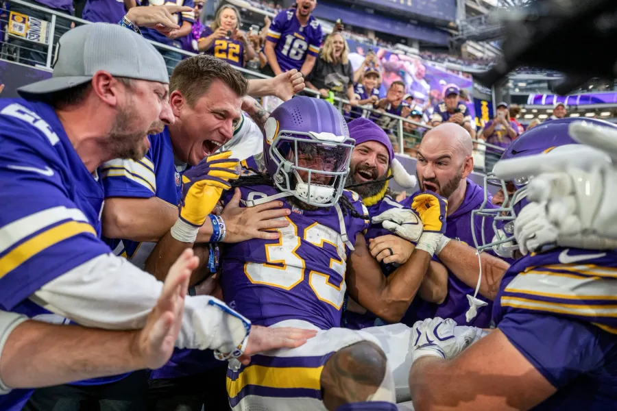 Vikings running back Dalvin Cook celebrates with fans at U.S. Bank Stadium