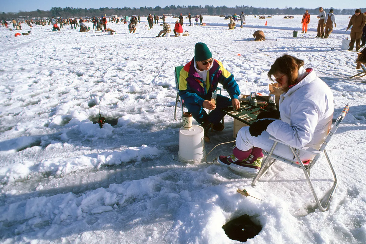 A couple competes in the Ice Fishing Extravaganza in Brainerd Lakes