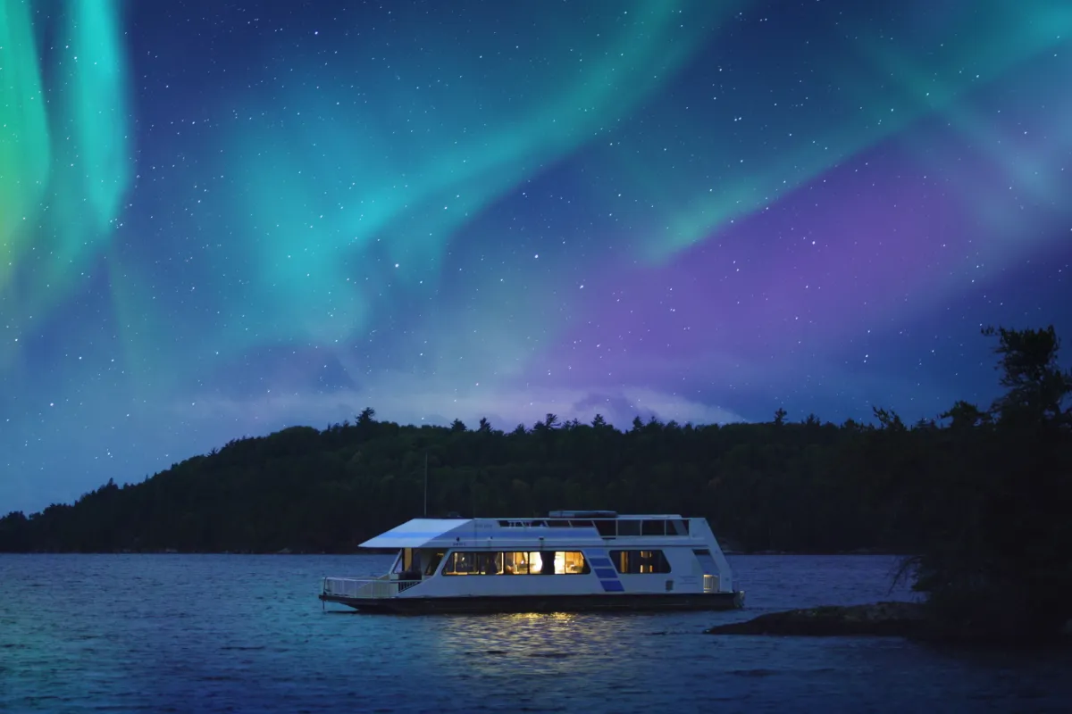Northern lights over a houseboat in Voyageurs National Park