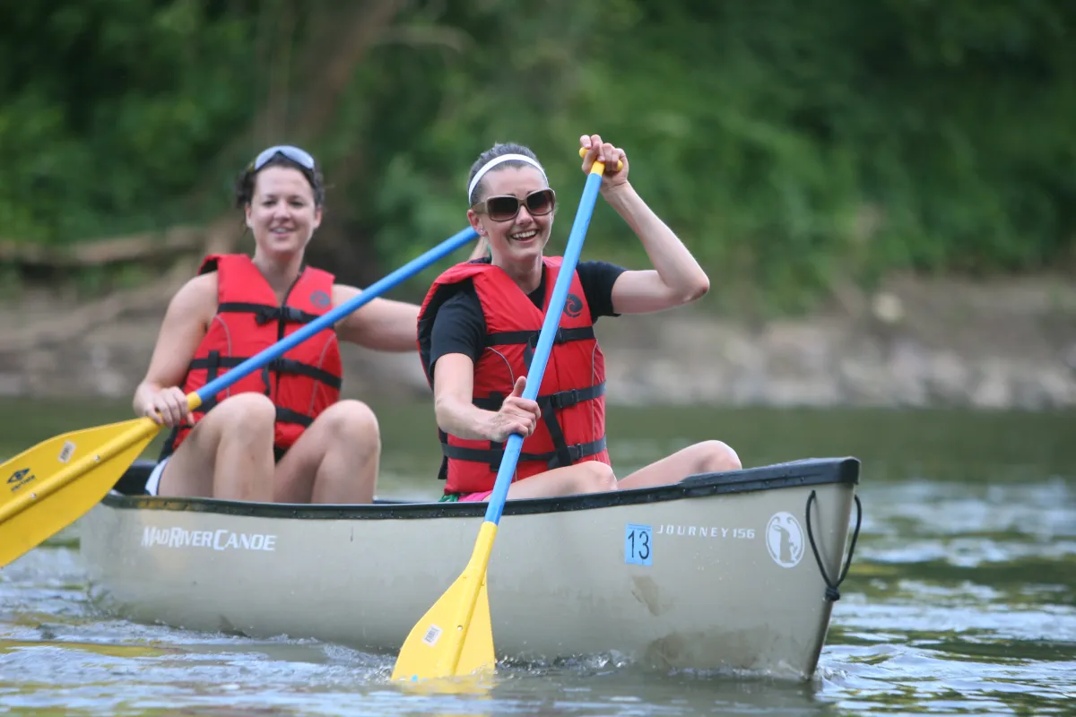 Two women kayaking Blue Earth River in Mankato