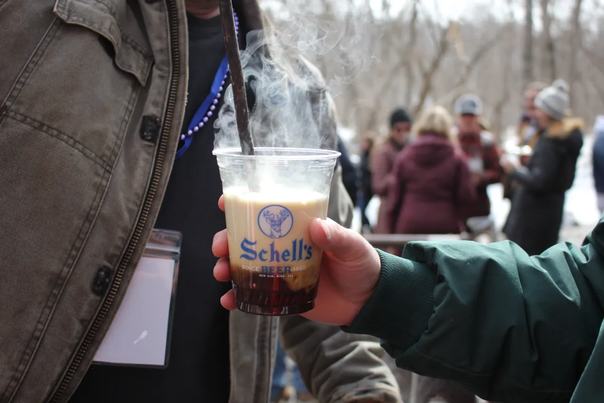 A poker gets plunged into a beer at Schell's BockFest