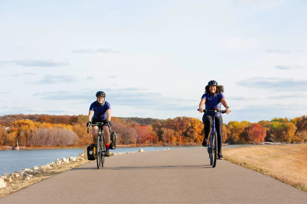 Two women bike along the Mississippi River Trail in South St. Paul