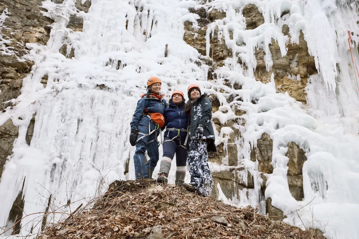 Three friends gather at the bottom of Winona's Ice Climbing Park