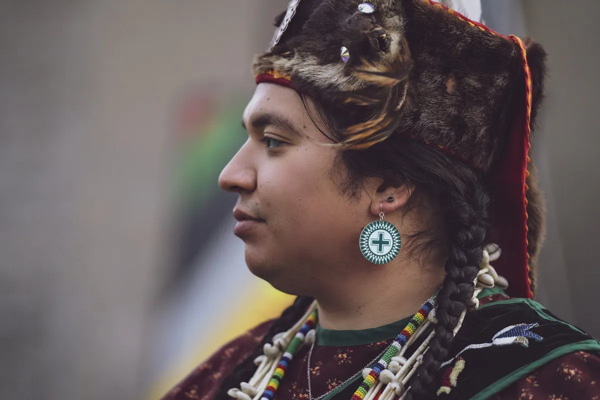 A model wears earrings by Četáŋ Ská designer Dyani White Hawk