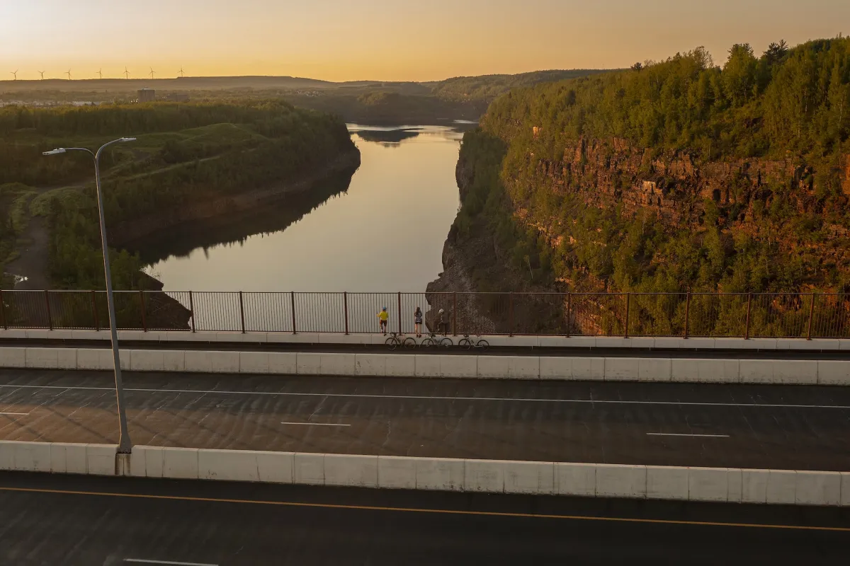 Bikers look out from the Thomas Rukavina Memorial Bridge in Virginia