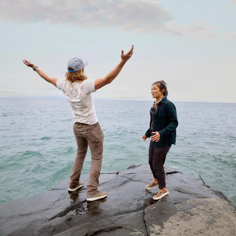 A couple stands on the shores of Lake Superior in Northern Minnesota 