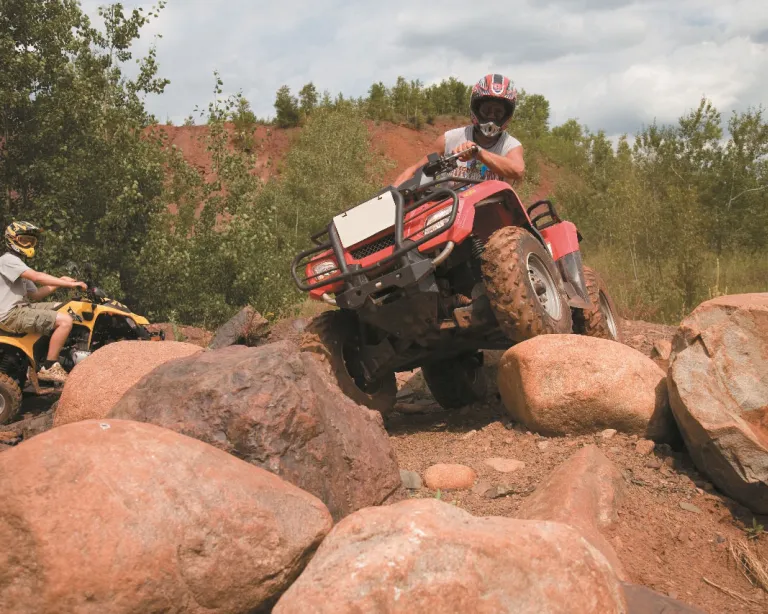 ATV rider rock crawling at the Iron Range OHV Recreation Area in Gilbert