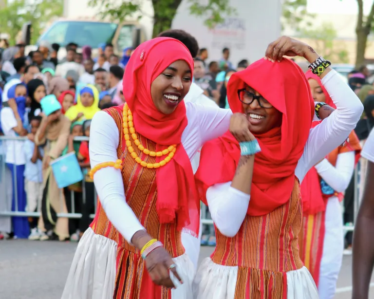 Two Somali dancers laughing