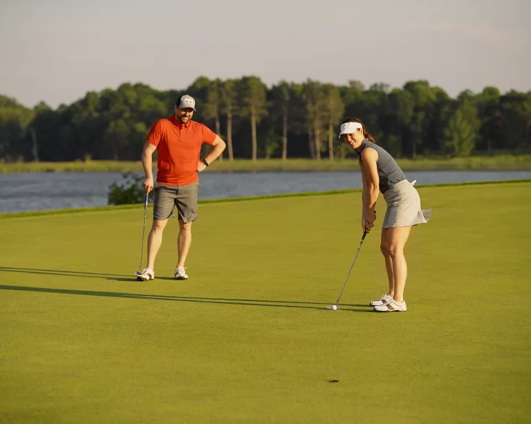 Woman putting at Deacon's Lodge