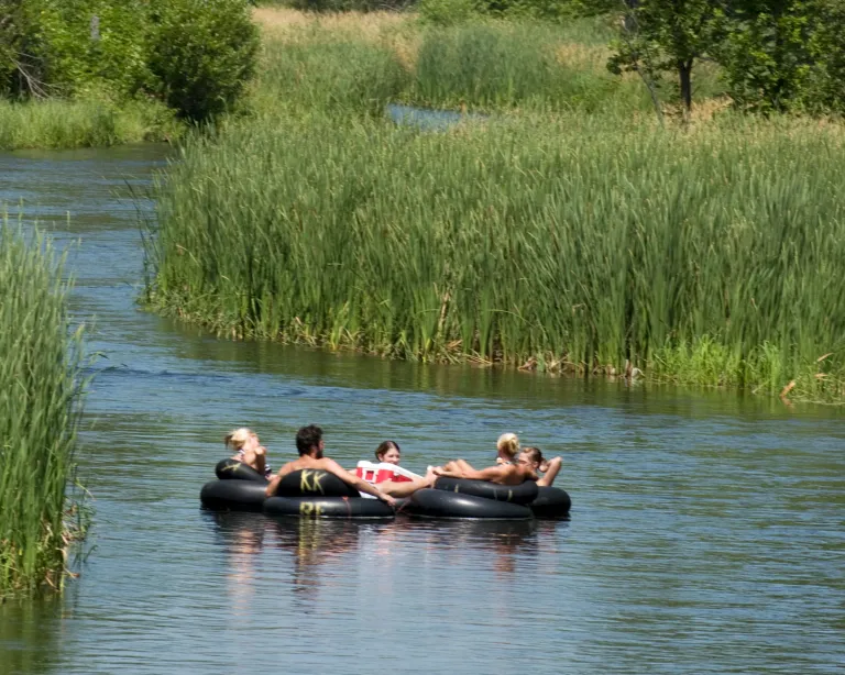 Group of friends river tubing on the Otter Tail River