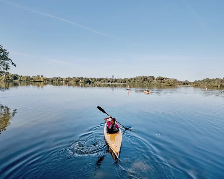 Person kayaking the Chain of Lakes in Minneapolis