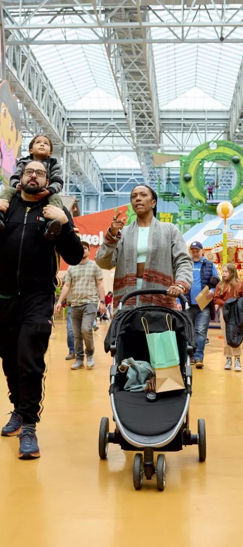 A family walks around Nickelodeon Universe at Mall of America